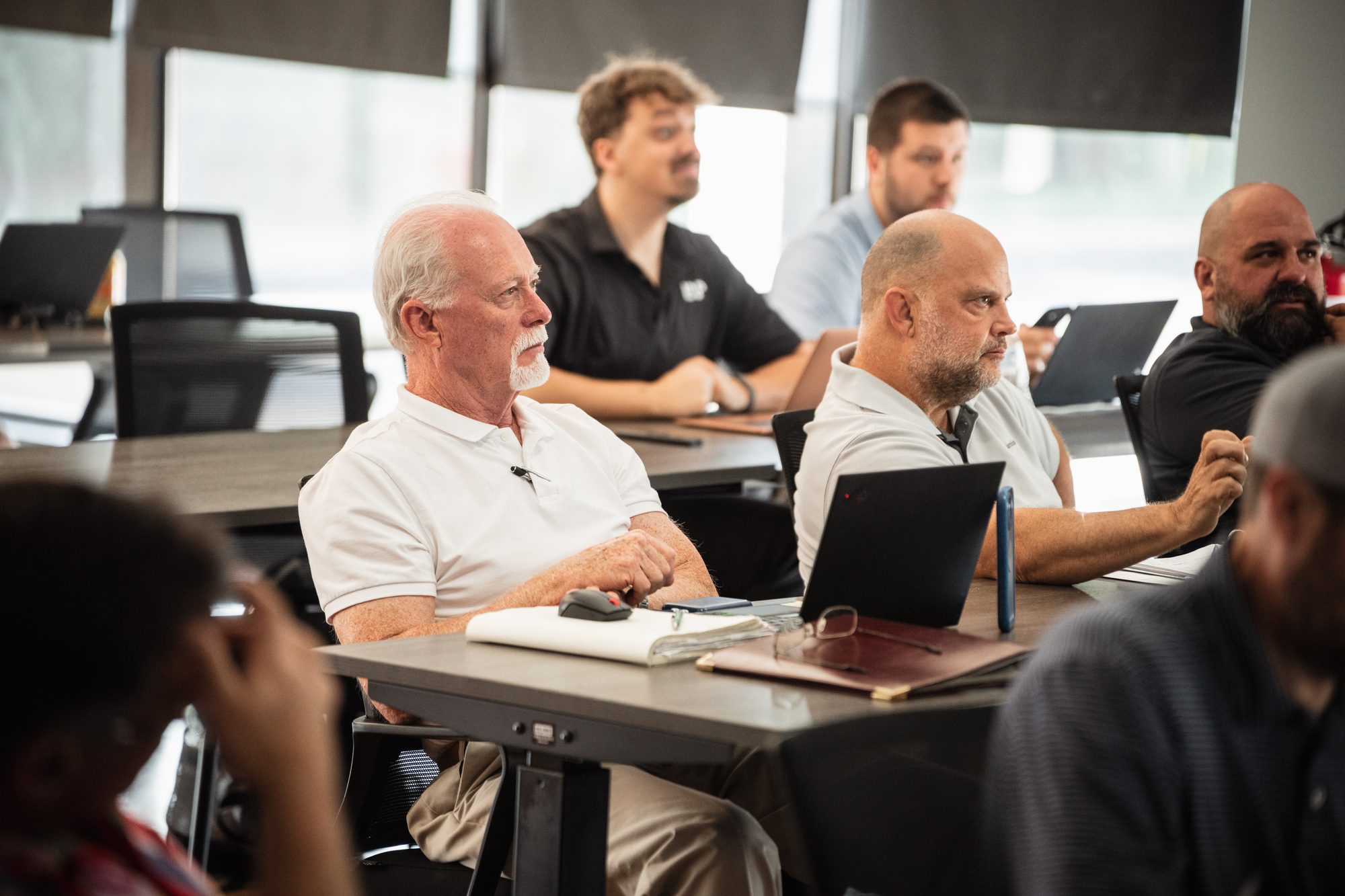 Attendees listening at a session